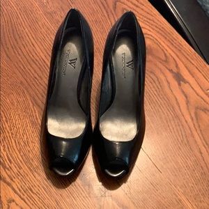 High Heeled shoes. Peek a boo toe.